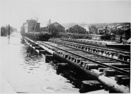 Hoist Bay, Namakan Lake where the Virginia and Rainy Lake Lumber Company loaded its logs, ca. 1920.