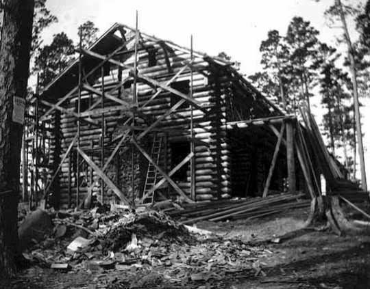 Black and white photograph of T. & S. Meyer of Park Rapids building Douglas Lodge, 1904.