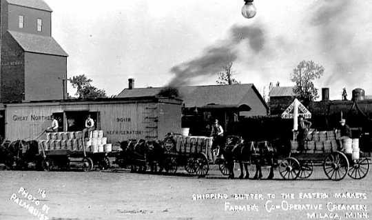 Photograph postcard depicting a shipment of butter produced by Farmers Cooperative Creamery in Milaca, c.1915.