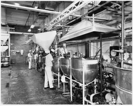 Stainless steel kettles used for cooking cream for candy bar center, Pearson's Candy Company, St. Paul, 1970.