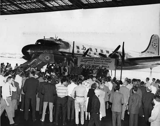 Black and white photograph of the inauguration ceremonies for Northwest Airlines' first flight over the "Great Circle" to the Orient, 1947.