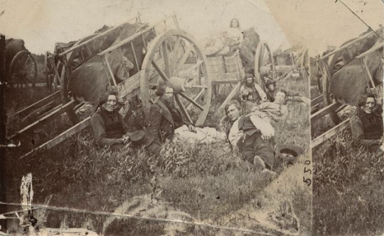 Black and white photograph of Métis drivers with Red River ox carts, probably in Minnesota, 1860.
