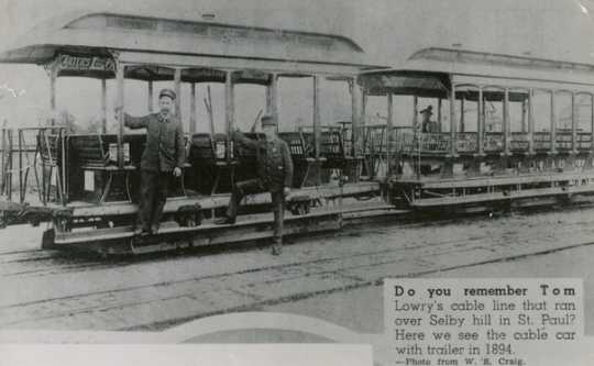 Black and white photograph of a six-bench open car and trailer on the Selby Avenue line, St. Paul, 1894.