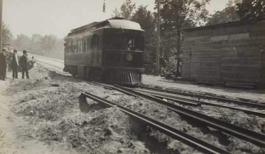 Black and white photograph of cars on the Dan Patch line, 1910. 