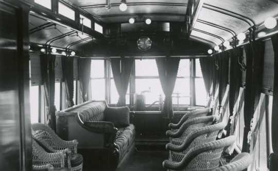 Black and white photograph of the interior of Thomas Lowry's private streetcar, c.1900.