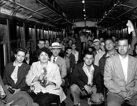 Black and white photograph of passengers on the last Minneapolis streetcar run, June 18, 1854. Photographed by St. Paul Dispatch & Pioneer Press. 