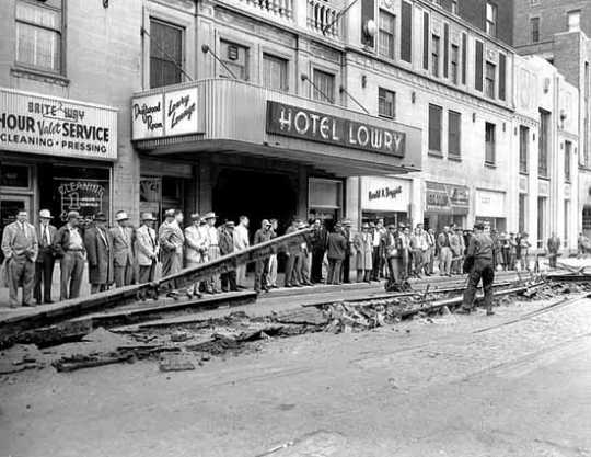 Black and white photograph of trolley track removal, Fourth and Wabasha, St. Paul, April 12, 1955.