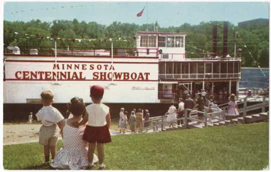 Theater-goers boarding the Minnesota Centennial Showboat on the East Bank River Flats below the University of Minnesota Campus, 1970. 