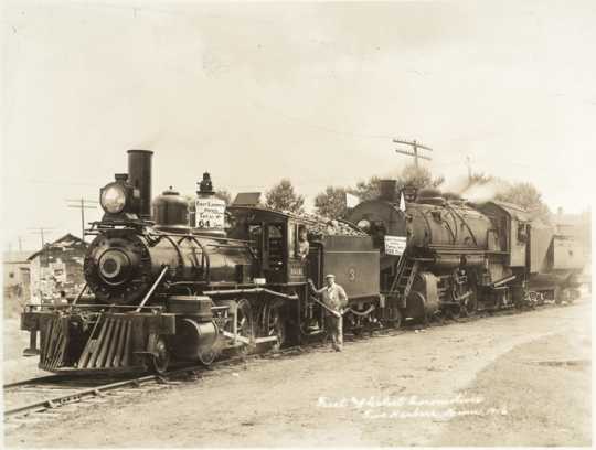 Black and white photograph of the first (#3) and latest (#307) locomotives, Duluth, Missabe and Iron Range Railway Company, Two Harbors, 1916.