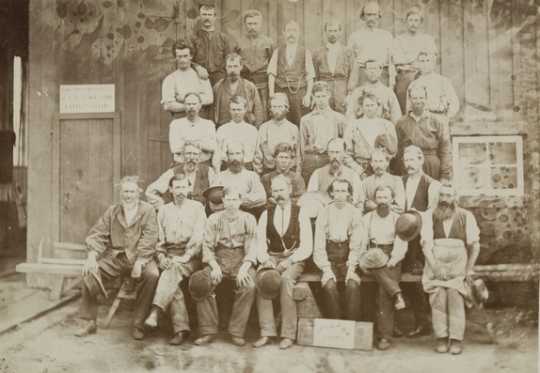 Black and white photograph of St. Paul and Pacific Railroad employees, 1873. Photographed by Redington & Shaffer.  