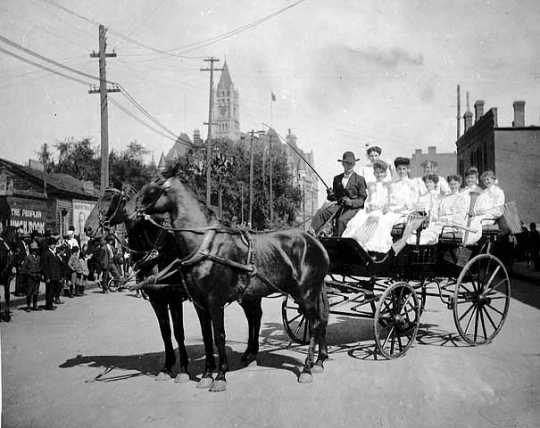 United Garment Workers Union members in a horse drawn carriage on Labor Day, St. Paul, 1905.