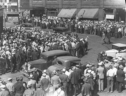 Black and white photograph of a street scene, Truck drivers’ strike, 1934.