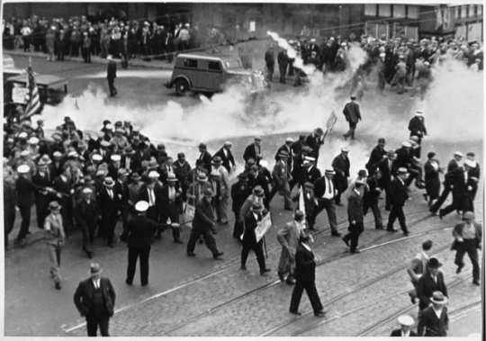 Black and white photograph of tear gas being used on demonstrators during the truck drivers’ strike, 1934.