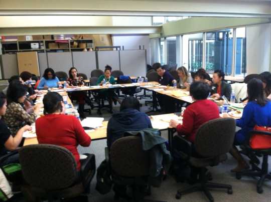 Color image of a meeting of the Hmong Health Care Professionals Coalition, 2013.