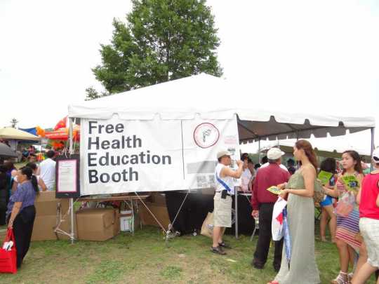 Color image of the Hmong Health Care Professionals Coalition Health Fair , 2013.