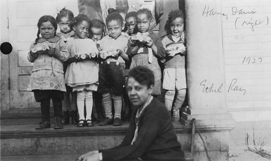 Black and white photograph of an Easter party at Phyllis Wheatley House, Minneapolis (Ethel Ray Nance, center right), ca. 1927.