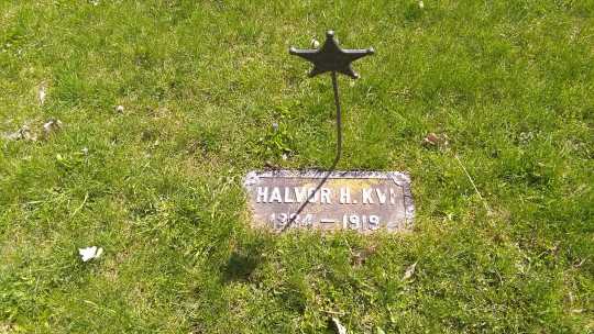 Halvor H. Quie’s headstone, undated. It uses the original Norwegian spelling of his surname: Kvi. Used with the permission of the photographer, Jeff M. Sauve.