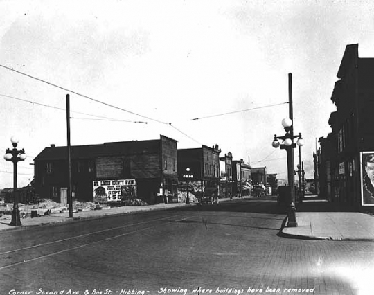 Corner Second Avenue and Pine Street, showing where buildings have been removed, Hibbing.