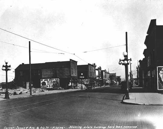 Corner Second Avenue and Pine Street, showing where buildings have been removed, Hibbing.