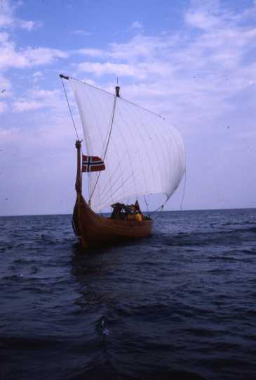 Color image of the Hjemkomst and crew on open water during their voyage to Norway, 1982. From the Tom Asp Collection, Historical and Cultural Society of Clay County.