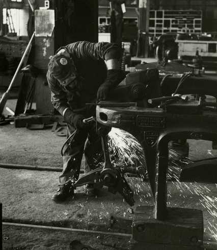 Black and white photograph of a worker at the Northern Pacific Railway Company Como Shops, St. Paul, 1970. Photograph by Joe E. B. Elliott.