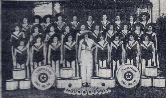 Black and white photograph of the drum and bugle corps in pajama uniforms, 1930s.