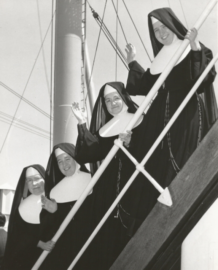 Black and white photograph of Sister Irmina Kelehan (bottom left) and other Sisters of St. Joseph setting sail for Japan, 1956.