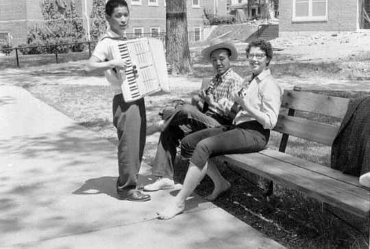 Photograph of Macalester students with accordion and ukuleles