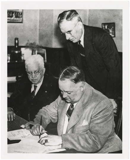 Senator Harry Wing signing a complaint