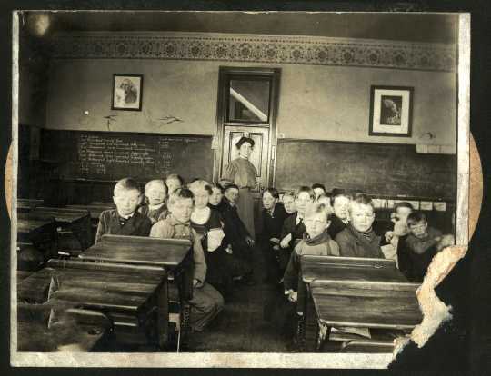 Photograph of students in Harmony's frame school, 1900