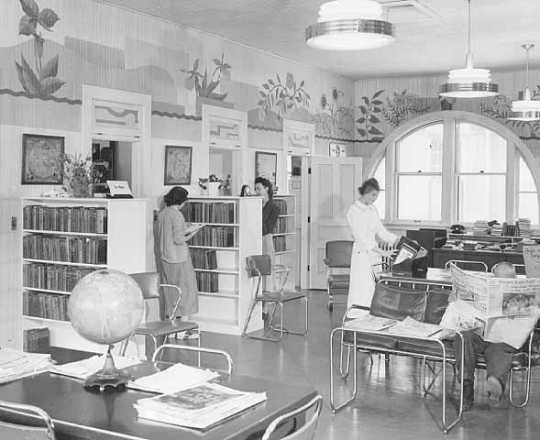Black and white photograph of a library, at Rochester State Hospital, 1951.