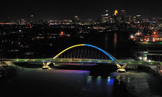 Lowry Avenue Bridge lit up in the colors (yellow and blue) of the Ukrainian flag