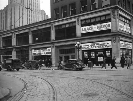 Black and white photograph of a Minneapolis street corner showing the Farmer-Labor Party headquarters, 1937.