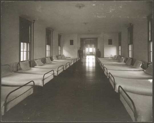 Interior view of a dormitory ward at the Anoka State Hospital, ca. 1910.