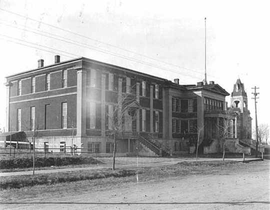 Black and white photograph of Turner Hall, 1895, site (outdoors) of the July 15, 1917, anti-draft rally. 