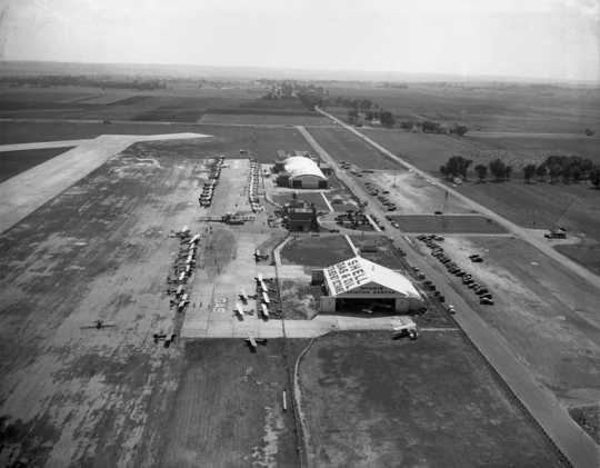 Black and white photograph of Northwest Airlines and McInnis Aviation Service hangars, Wold-Chamberlain Field, undated.