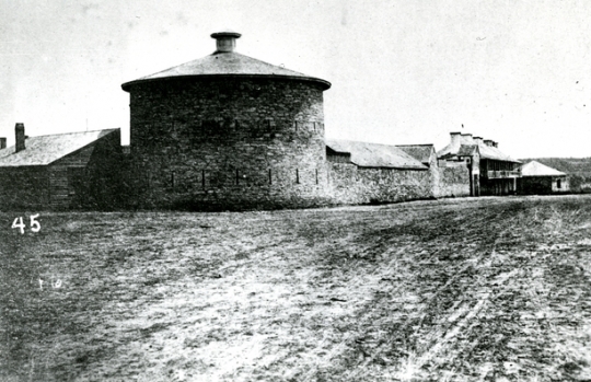 Black and white photograph of an exterior view of Fort Snelling showing the Round Tower, 1863.
