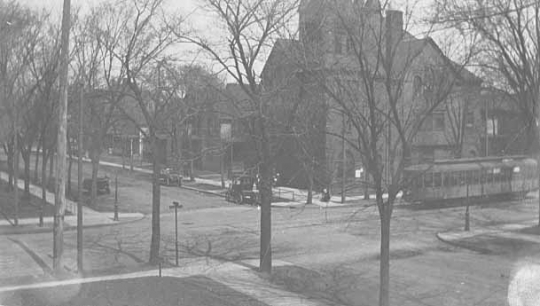 Black and white photograph of a street scene in the University District of Minneapolis, c.1920s.