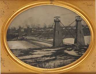 Black and white, daguerreotype-style photograph of the Hennepin Avenue Bridge, c.1857.