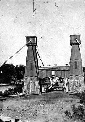Black and white photograph of the Hennepin Suspension Bridge, c.1865.