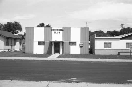 Black and white photograph of the Nacirema Club (“America backwards), 1975. 