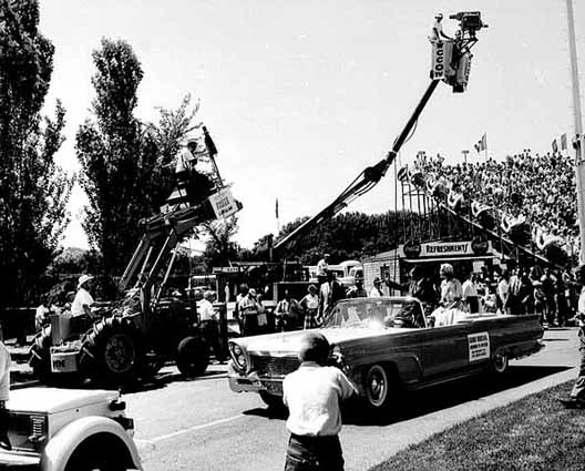 Black and white photograph of Aquatennial Parade Grand Marshal Richard M. Nixon departs Parade Stadium on the parade route, 1958.