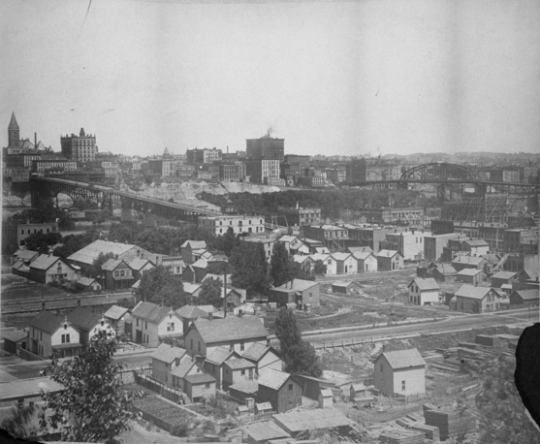 Black and white photograph of the West Side Flats and Wabasha Bridge, 1904.
