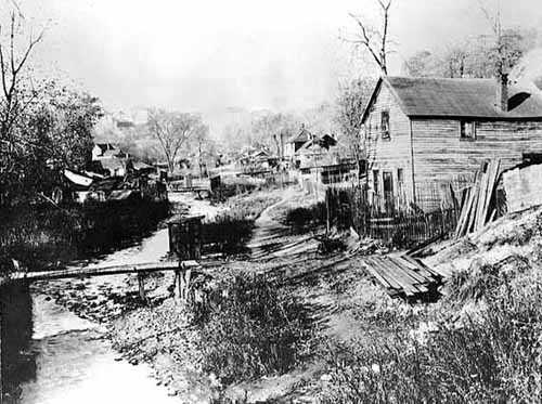 Black and white photograph of Swede Hollow looking north, c.1910.