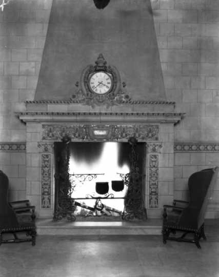 Black and white photograph of the baronial fireplace in the lobby of the St. Paul Athletic Club, c.1925.