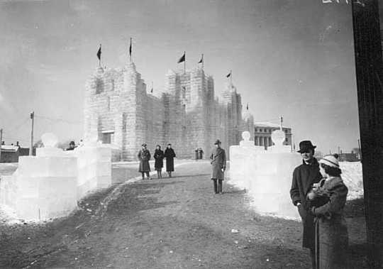 Black and white photograph of the 1937 Winter Carnival Ice Palace, looking west toward State Office Building.