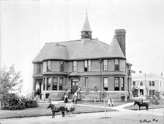 Back and white photograph of the exterior of Cottage Four at the State School, c.1900.