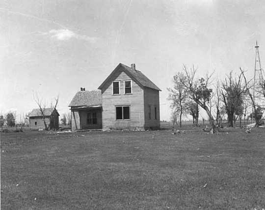 Black and white photograph of a farm abandoned after successive years of drought, possibly near Breckenridge in Wilkin County, 1939.