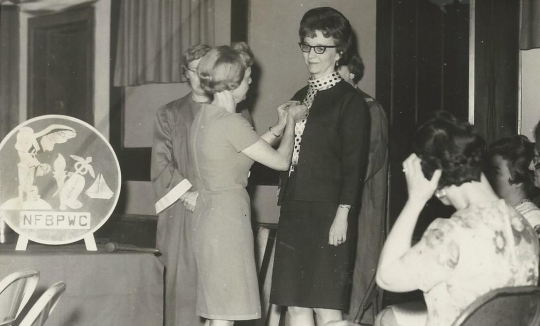 Black and white photograph of Doris Matzke is installed as BPWC president by former president June Shaver, May 1967.