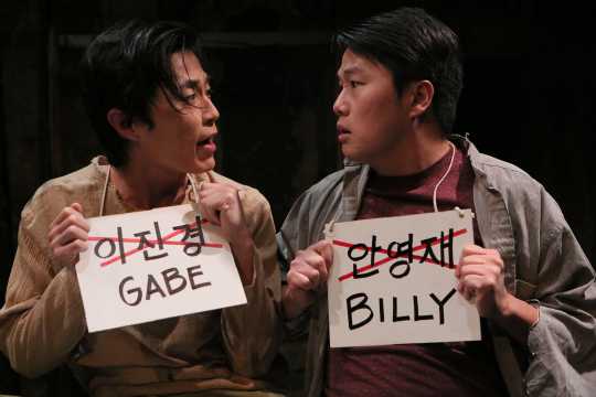 Color image of Gabe (Michael Sung-Ho) and Billy (Eric Sharp) in the Mu Performing Arts production of Middle Brother, written by Eric Sharp and directed by Robert Rosen, 2014. Michal Daniel, photographer.